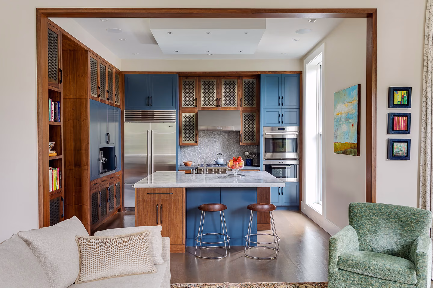 Framed by a broad cased opening, the kitchen reads as part of the living space rather than a room apart.