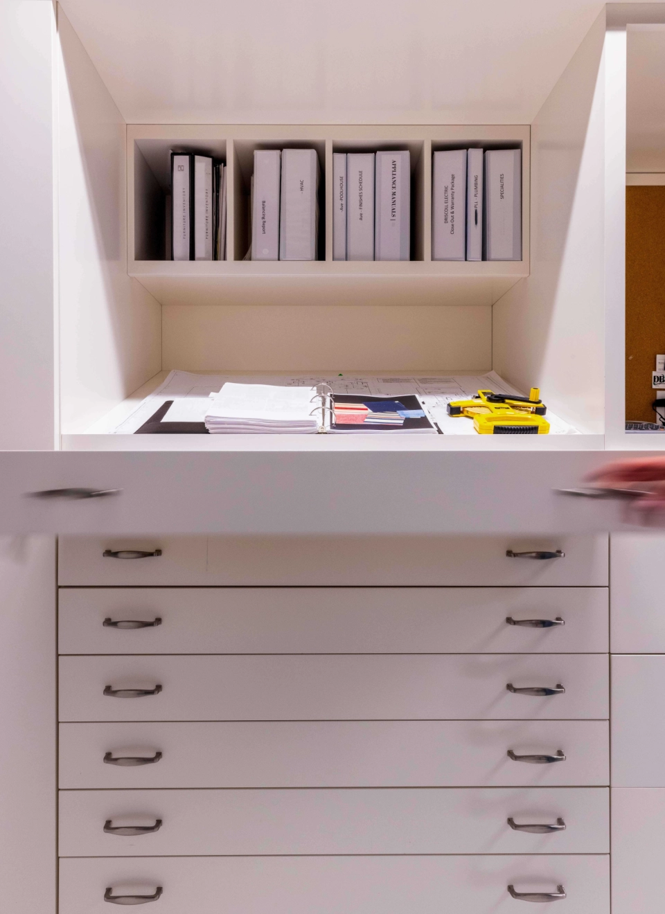 Closeout binders including HVAC, appliance manuals, and warranty package for a custom home