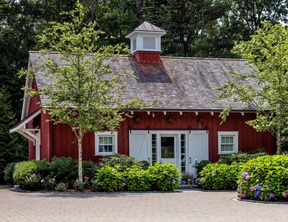 Cedar shake roof and copper flashing on a New England estate outbuilding